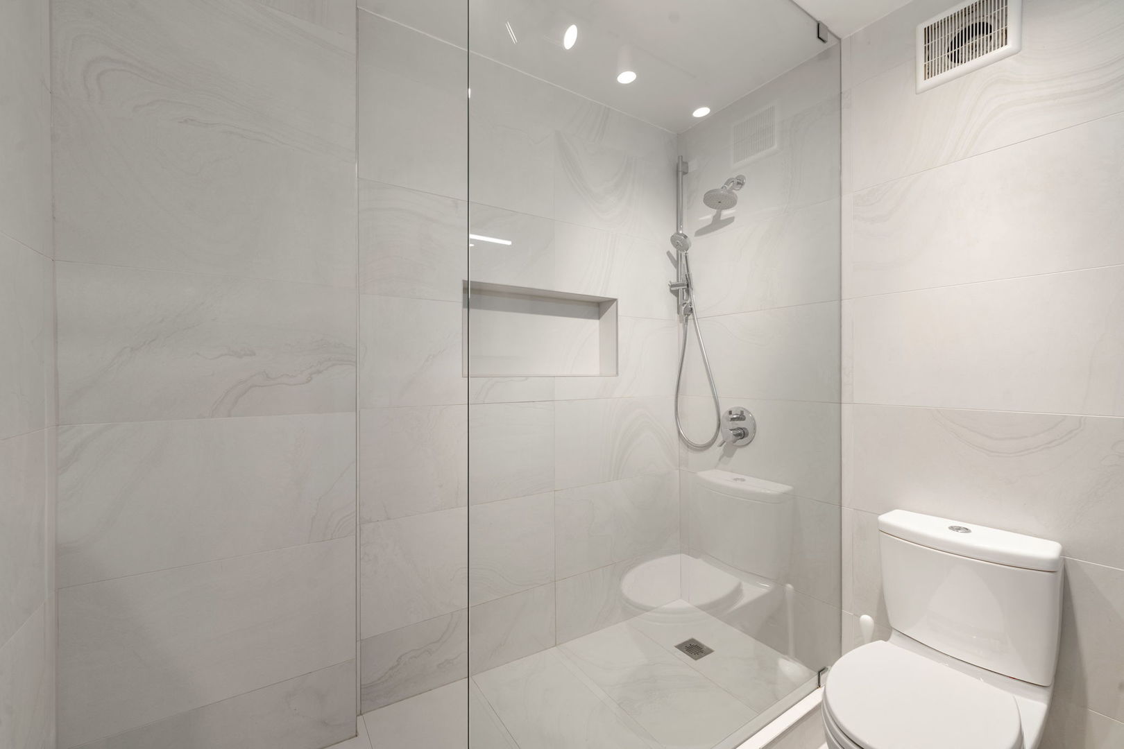 1516 North State Parkway, Unit 5D Chicago, IL 60610 - Photo 16 of 33 a bathroom with a shower a toilet and sink