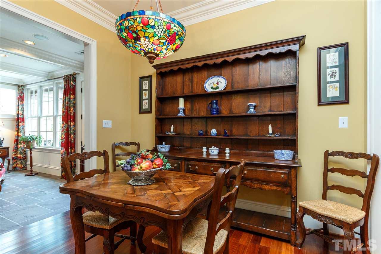 3721 Rolston Drive Raleigh, NC 27609 - Photo 11 of 30 a view of a dining room with furniture and wooden floor