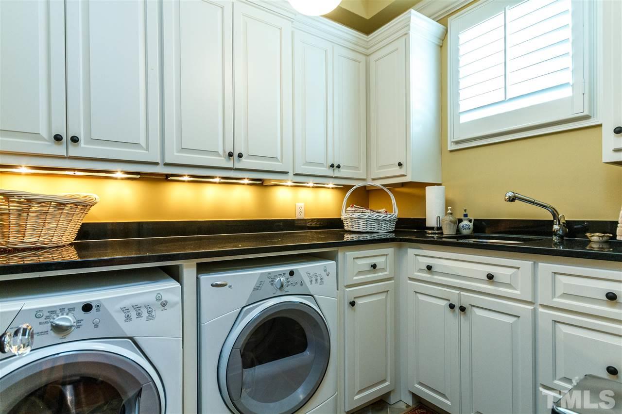 3721 Rolston Drive Raleigh, NC 27609 - Photo 18 of 30 a view of kitchen with washer and dryer
