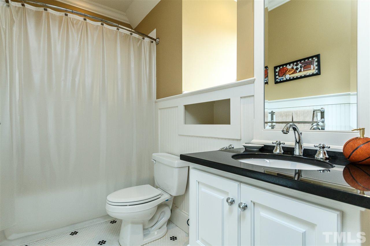 3721 Rolston Drive Raleigh, NC 27609 - Photo 20 of 30 a bathroom with a sink and a toilet