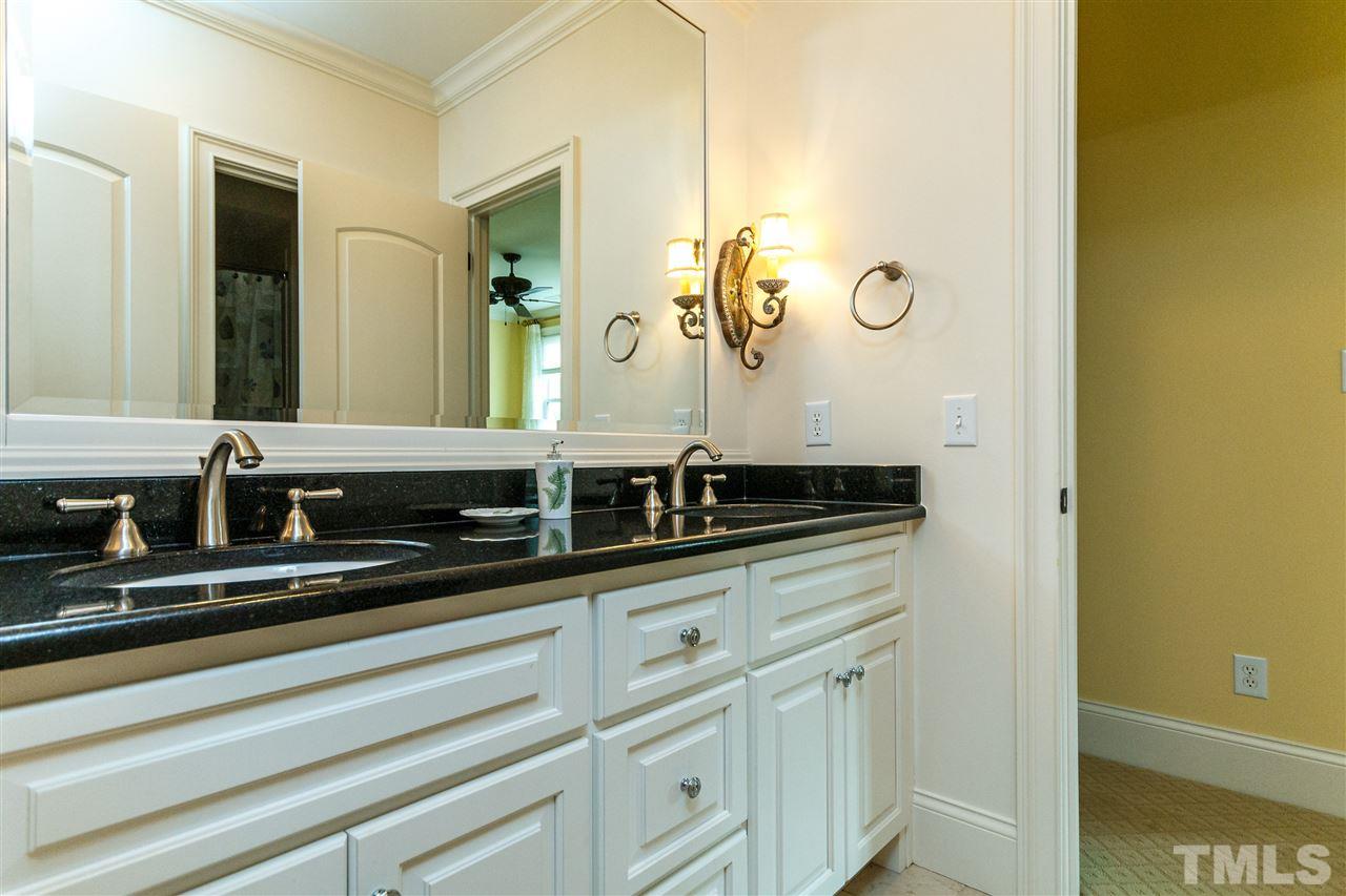 3721 Rolston Drive Raleigh, NC 27609 - Photo 22 of 30 a bathroom with a sink and a mirror