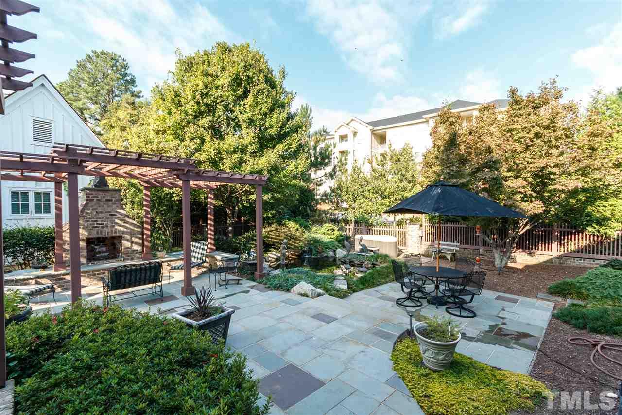 3721 Rolston Drive Raleigh, NC 27609 - Photo 25 of 30 a view of a patio with furniture and a fire pit