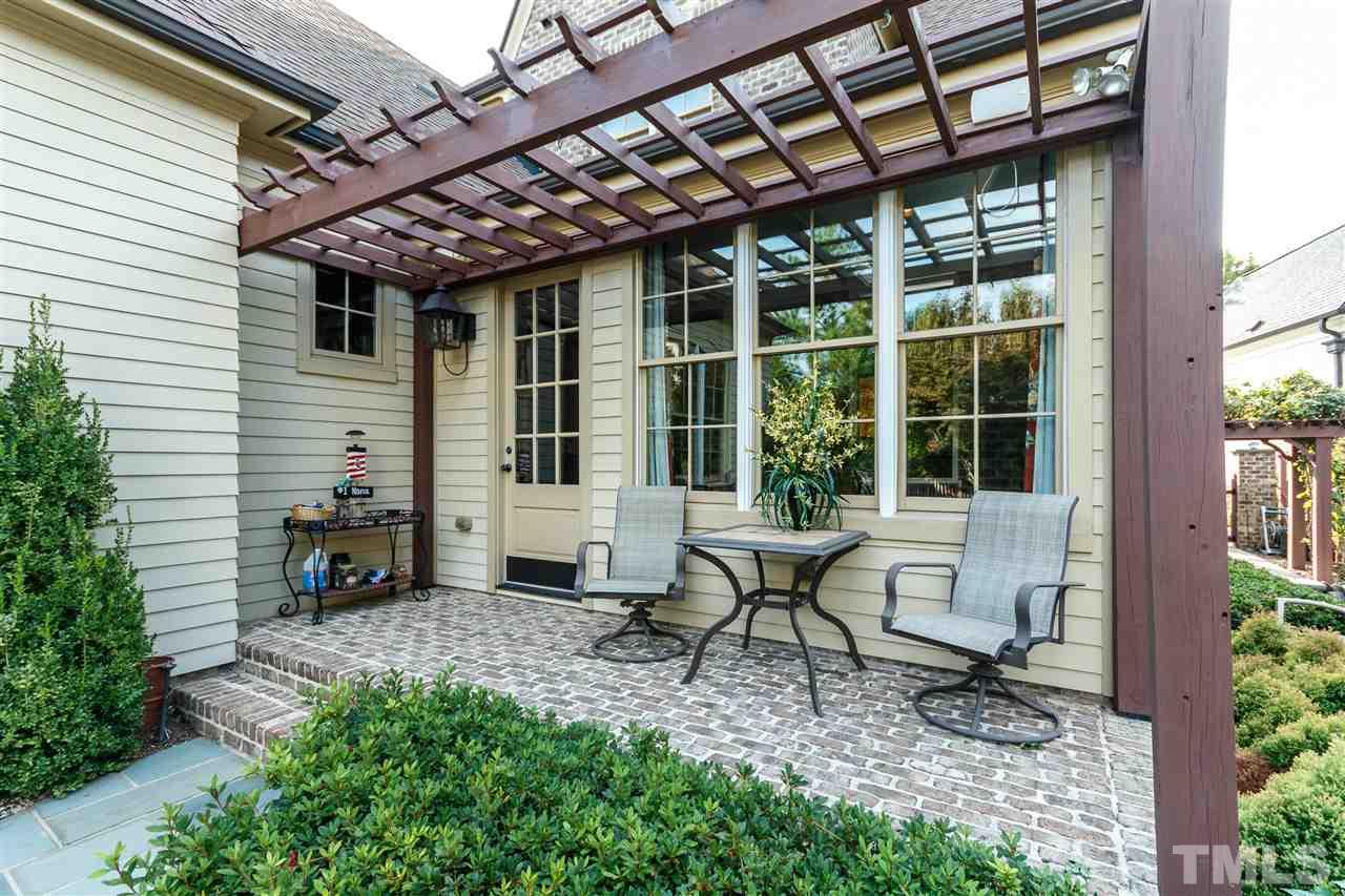 3721 Rolston Drive Raleigh, NC 27609 - Photo 26 of 30 a view of a backyard with sitting area and garden