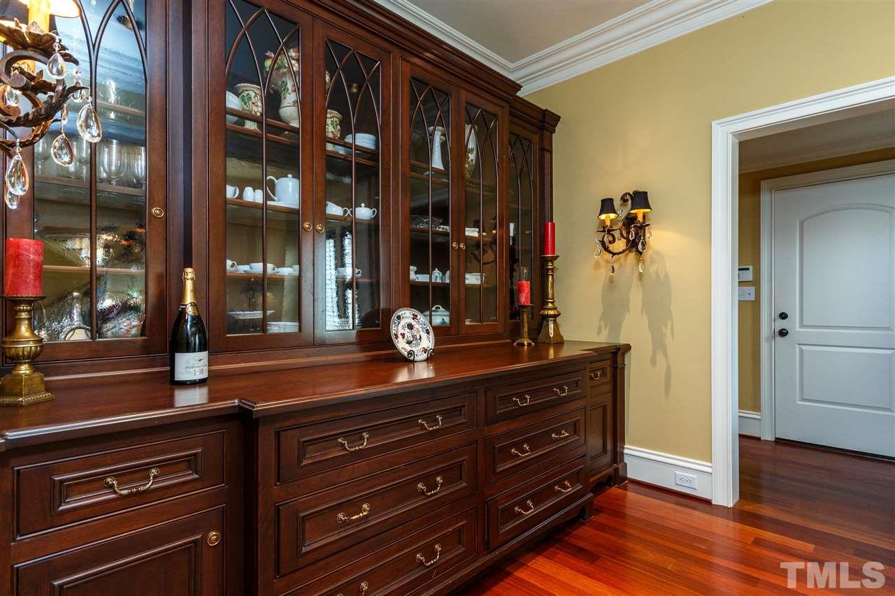 3721 Rolston Drive Raleigh, NC 27609 - Photo 4 of 30 a room with a dresser and a mirror