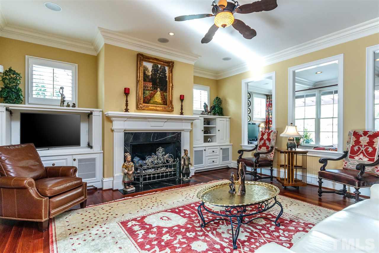 3721 Rolston Drive Raleigh, NC 27609 - Photo 5 of 30 a living room with furniture a window and a fireplace