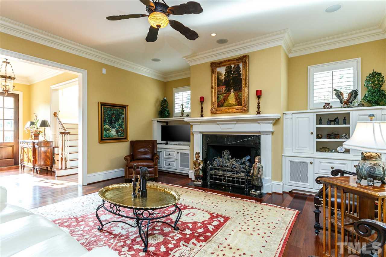 3721 Rolston Drive Raleigh, NC 27609 - Photo 6 of 30 a living room with furniture and a fireplace