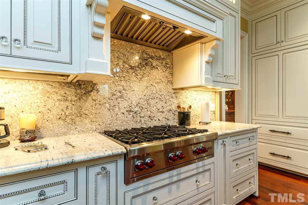 3721 Rolston Drive Raleigh, NC 27609 - Photo 10 of 30 a kitchen with granite countertop a stove and a white stove