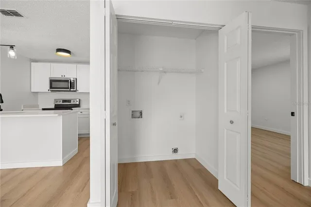 a view of kitchen with wooden floor