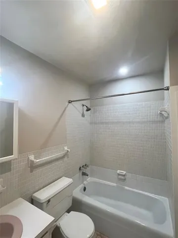 a view of a fountain in the backyard of house along with trees