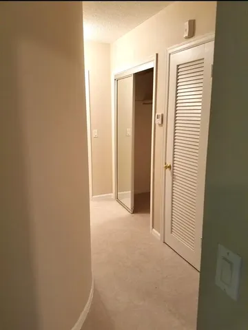 a view of a room with a hallway