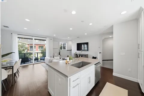 a view of a dining room with furniture and a potted plant