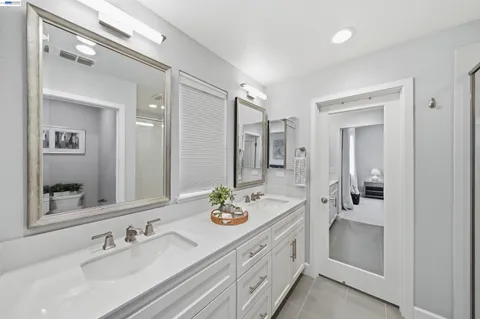 a bedroom with a bed and a potted plant