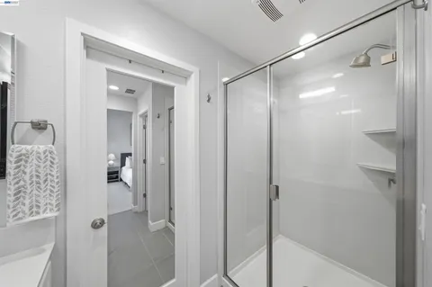 a bedroom with bed and a window