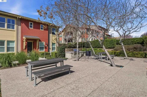 a view of a backyard with sitting area