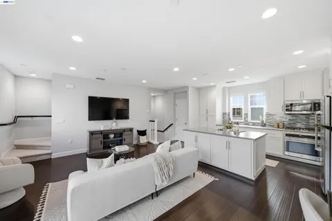 a living room with fireplace furniture and a flat screen tv