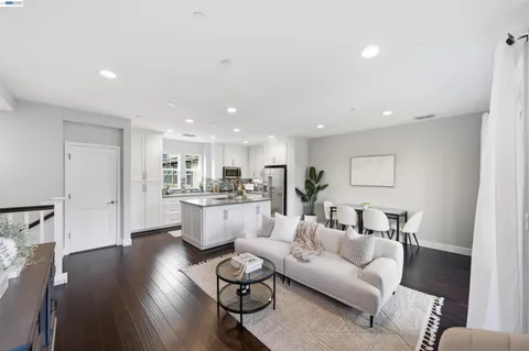 a kitchen with refrigerator and cabinets