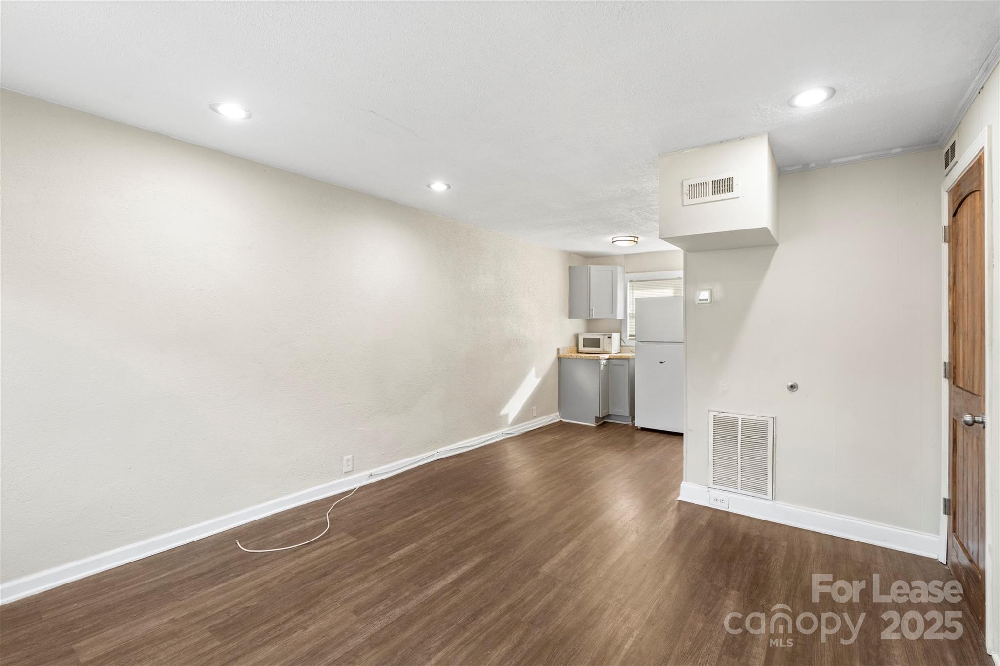 2405 Julia Avenue, Unit 1 Charlotte, NC 28206 - Photo 12 of 15 a view of empty room with wooden floor