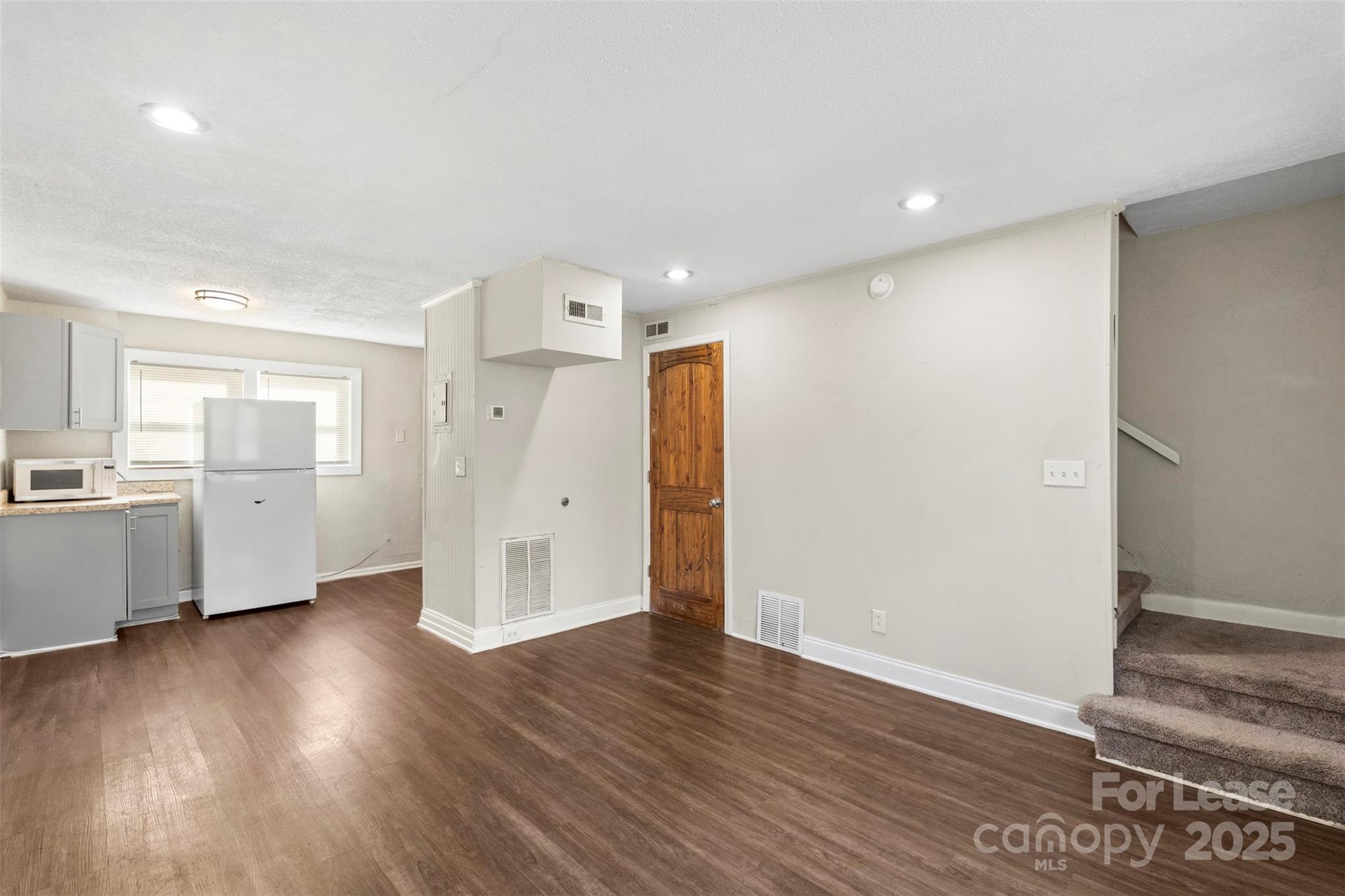 2405 Julia Avenue, Unit 1 Charlotte, NC 28206 - Photo 3 of 15 a view of a kitchen with wooden floor and a sink