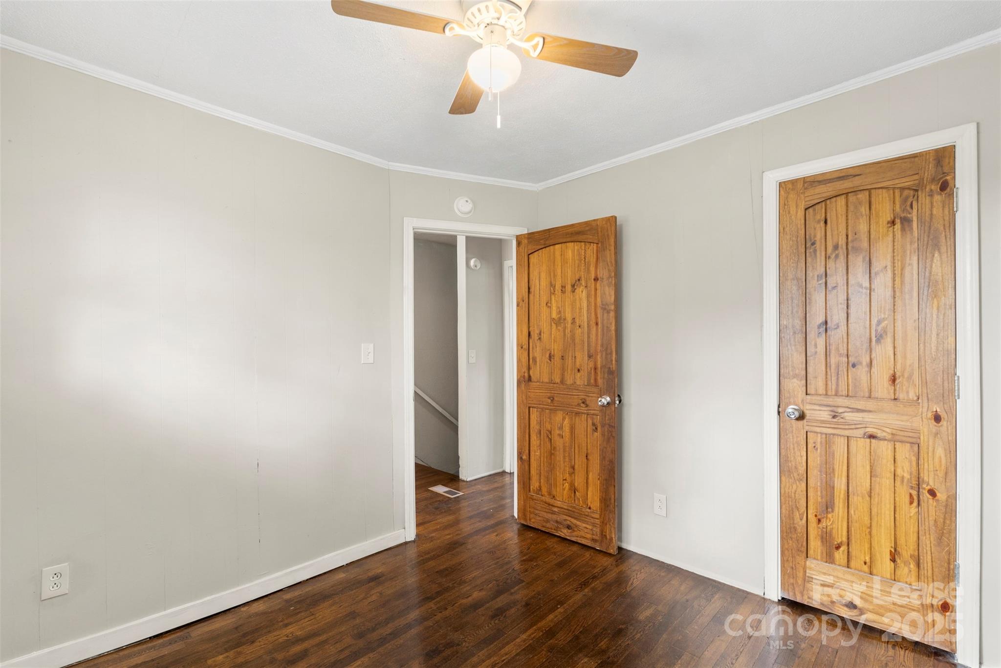 2405 Julia Avenue, Unit 1 Charlotte, NC 28206 - Photo 9 of 15 an empty room with wooden floor closet and windows