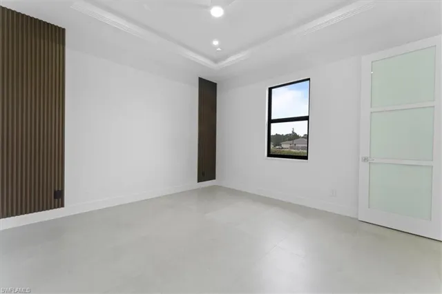 an empty room with windows and closet
