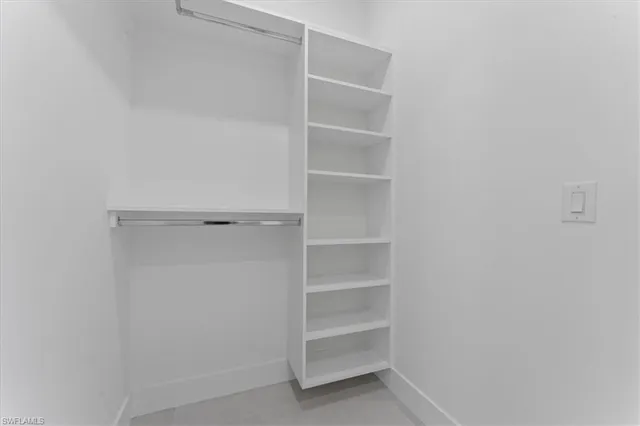 a view of an empty walk in closet