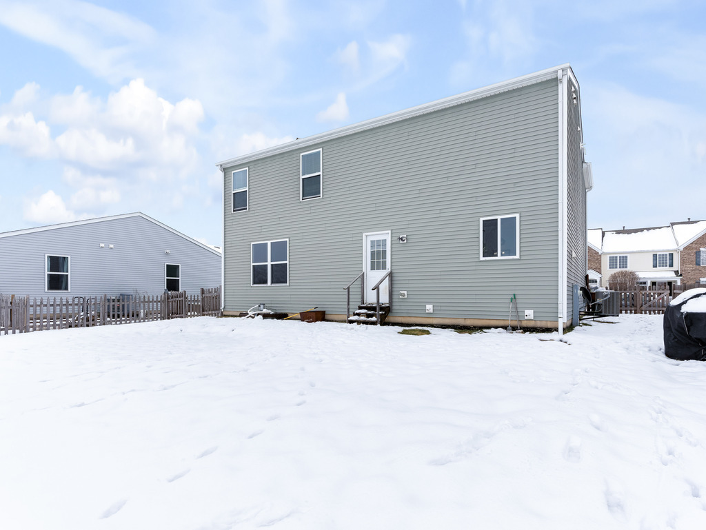1765 Sebastian Road Woodstock, IL 60098 - Photo 22 of 25 a backyard of a house