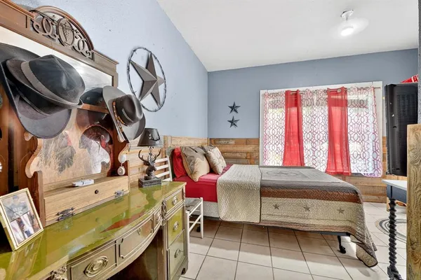 a bedroom with a bed and cabinets