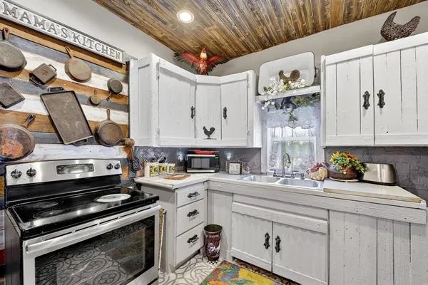 a kitchen with a stove and a sink