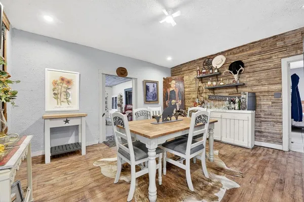 a dining room with furniture and window