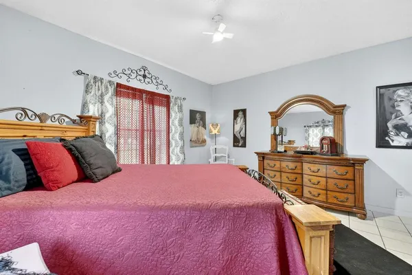 a bedroom with a bed and a dresser