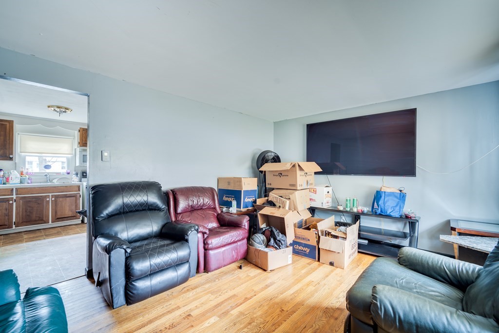 109 Middle Street Springfield, MA 01104 - Photo 3 of 14 a living room with furniture and a flat screen tv