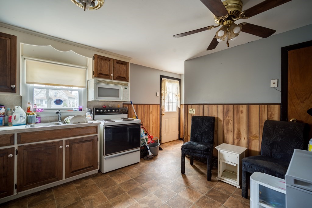109 Middle Street Springfield, MA 01104 - Photo 5 of 14 a living room with stainless steel appliances furniture and a window