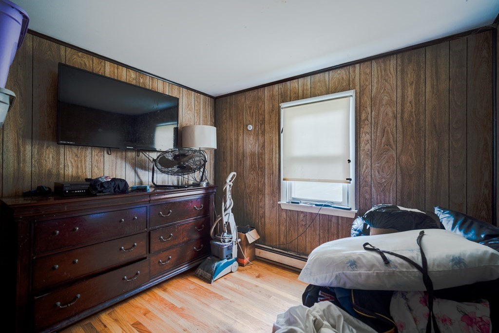109 Middle Street Springfield, MA 01104 - Photo 9 of 14 a bed room with a bed and a window