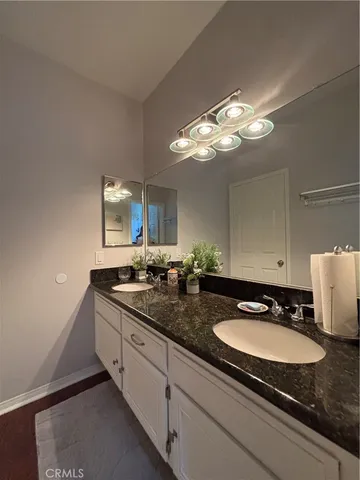 a white toilet sitting next to a shower curtain