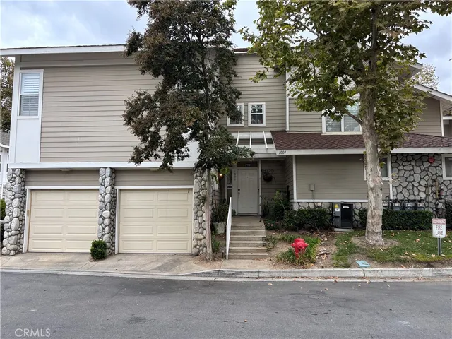 a front view of a house with garage