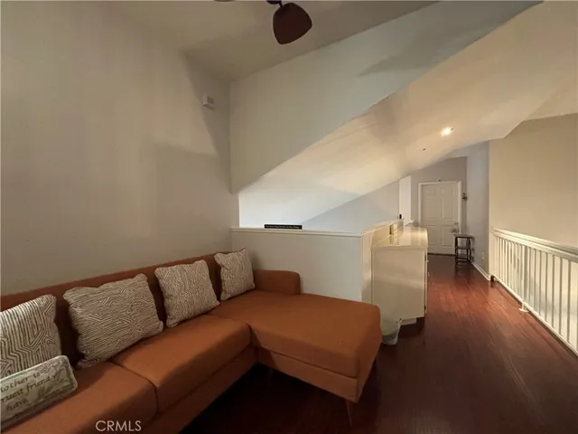 a room with furniture and a potted plant