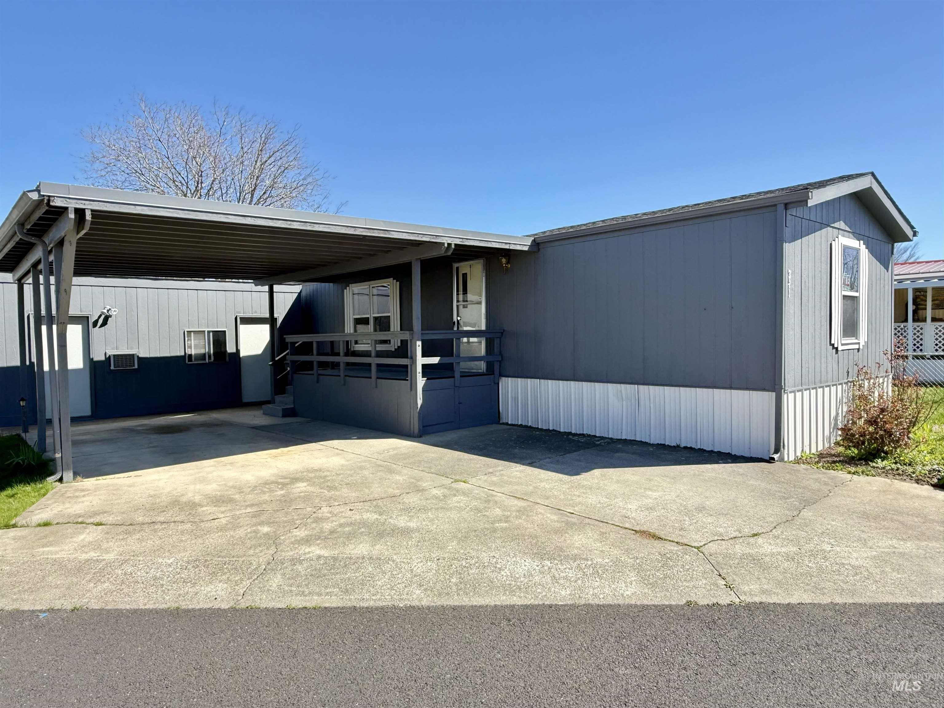 2015 6th Avenue, Unit 321 Clarkston, WA 99403 - Photo 34 of 34 Manufactured / mobile home featuring driveway, an attached carport, and a deck