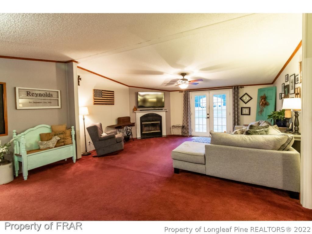 164 Sharp Lane Carthage, NC 28327 - Photo 3 of 28 a living room with furniture and a fireplace