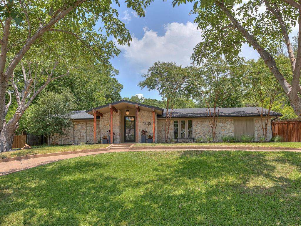 1805 Ridgmar Boulevard Fort Worth, TX 76116 - Photo 1 of 1 a front view of a house with a yard and trees