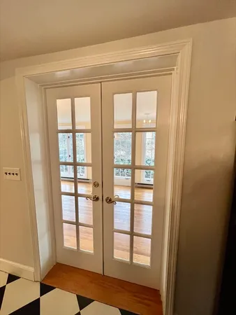 a view of wooden floor and windows in a room