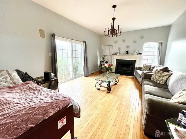 a bedroom with a bed and a fireplace