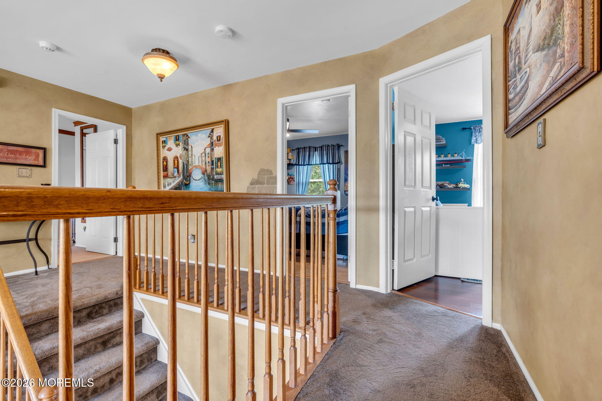 21 Ryan Road Marlboro, NJ 07746 - Photo 29 of 56 a view of a hallway to rooms and stairs