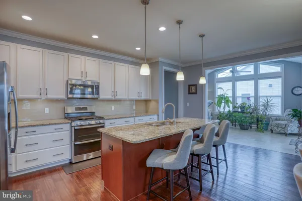 a kitchen with a table and chairs in it