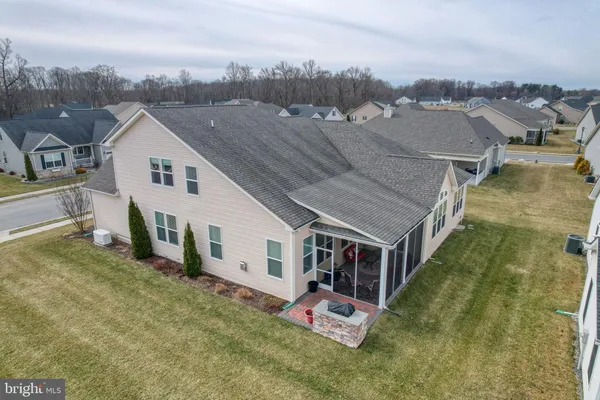 an aerial view of a house with a big yard