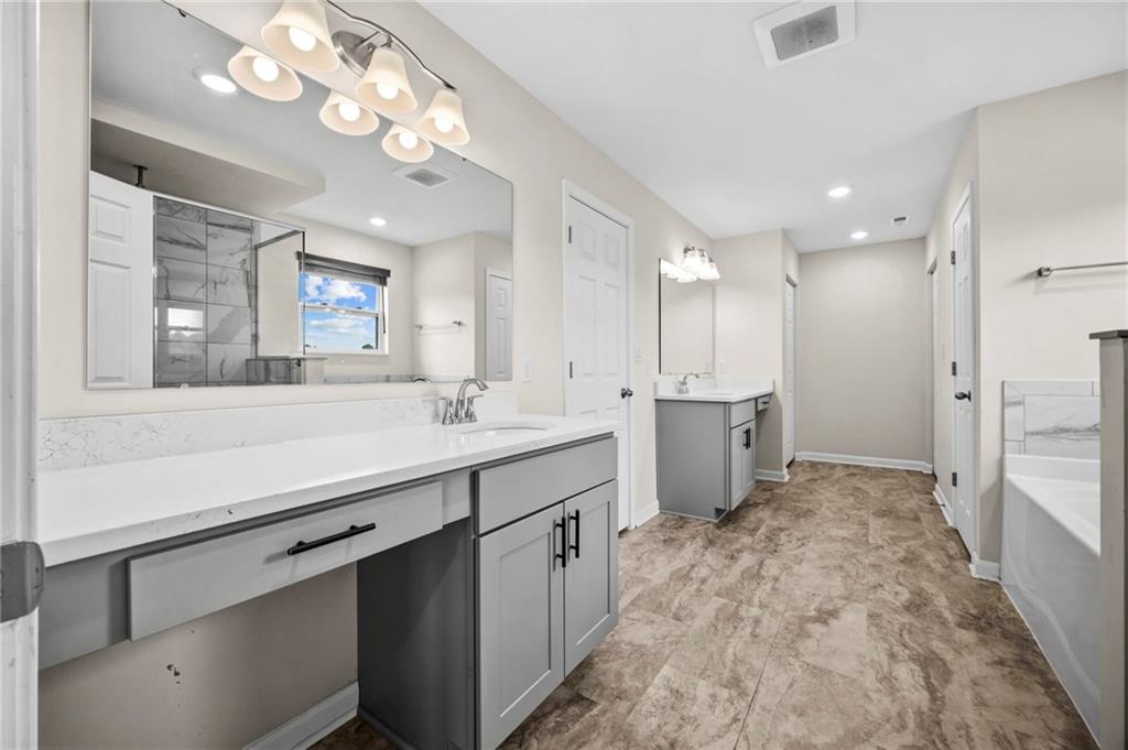 269 Lily Ridge Drive Canonsburg, PA 15317 - Photo 22 of 48 a bathroom with a sink a large mirror and a shower