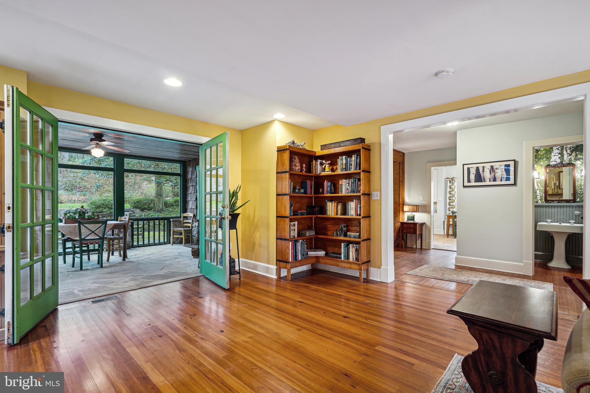 5305 Tuscarawas Road Bethesda, MD 20816 - Photo 14 of 72 Screened porch; bookcases do not convey