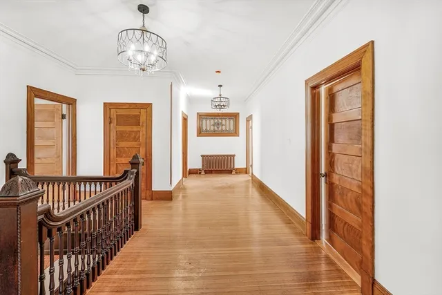 a spacious bedroom with a bed and a fireplace