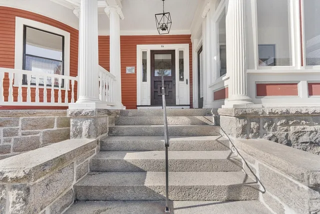 a view of a door and wooden floor