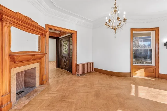a large kitchen with a large window and stainless steel appliances