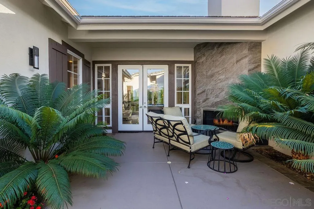 520 Latigo Row Encinitas, CA 92024 - Photo 55 of 65 a building outdoor space with patio furniture and potted plants